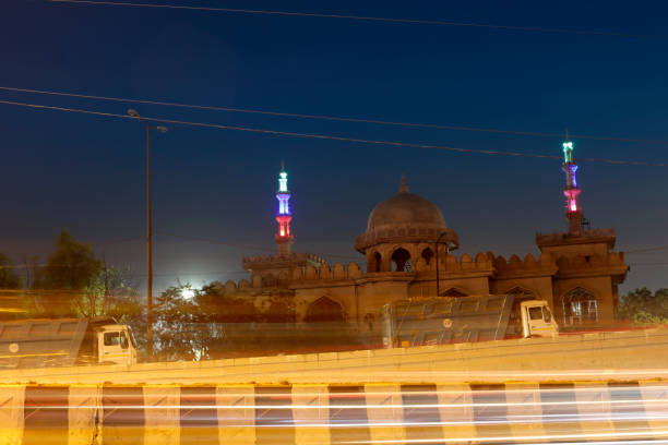 istock Light trails with Tomb in background 1474511841