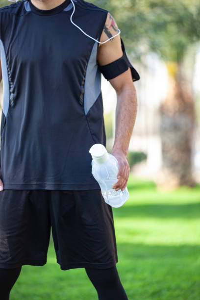istock Sportsman resting after running. 1474518010