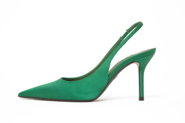 istock Green satin slingbacks heels with the classy pointed toe isolated on white backgrounds 1474522219