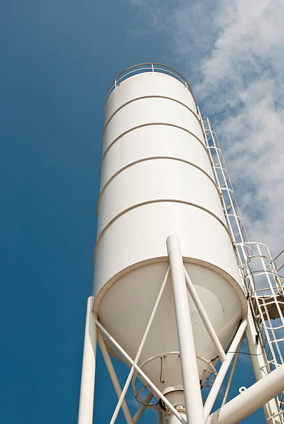 white silo on blue sky stock photo