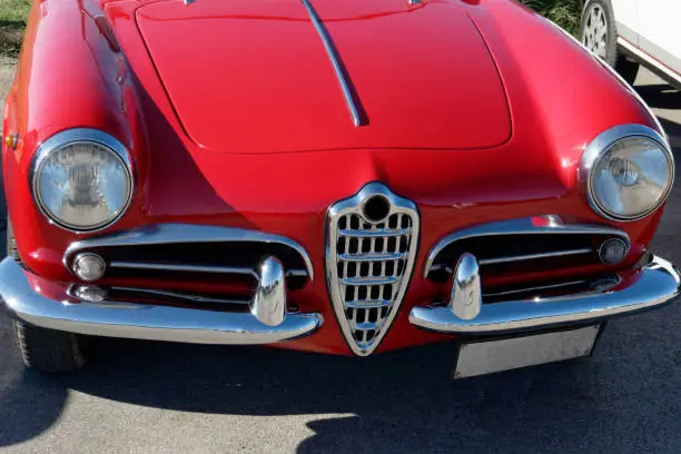 Front view of an old italian classic car . The car is a Alfa Romeo model