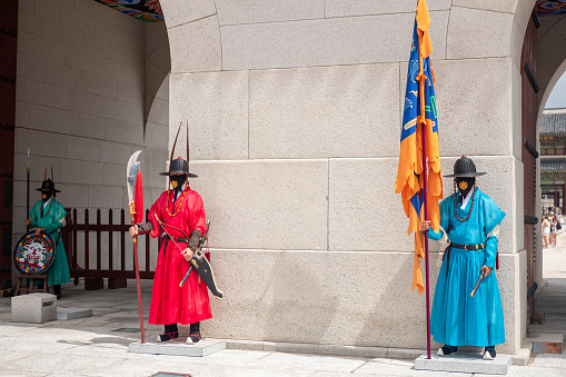 Seoul, South Korea - 14 July 2022: Royal guards at the Gwanghwamun gate of the Gyeongbokgung Palace