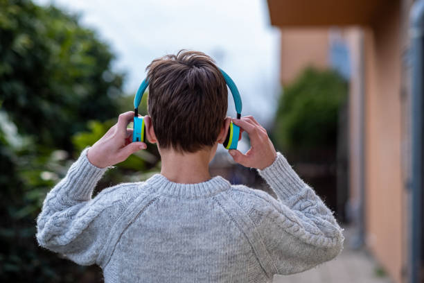 istock A boy with headphones on his head. 1474525473