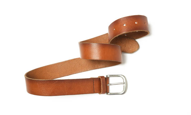 istock Brown leather belt with silver buckle isolated on white background 1474528287