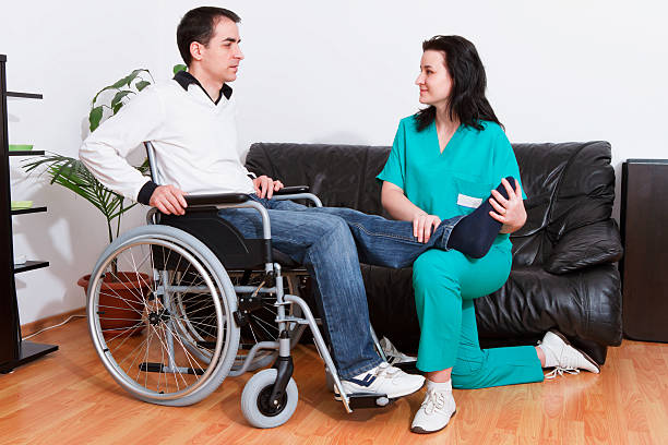 istock Physical therapist massaging man's foot 147452936