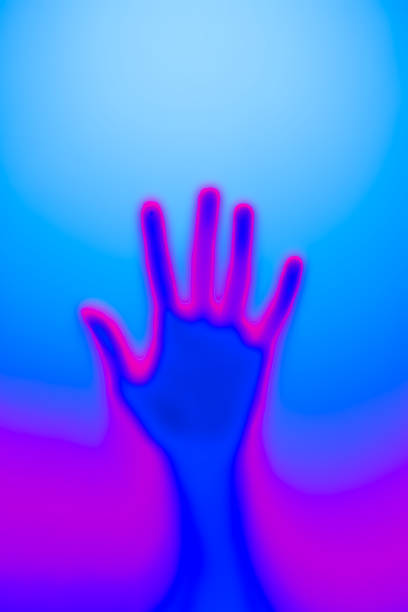 istock Silhouette of an open palm in neon light 1474532997
