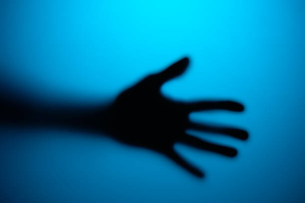 istock Silhouette of an open palm in neon light 1474533000