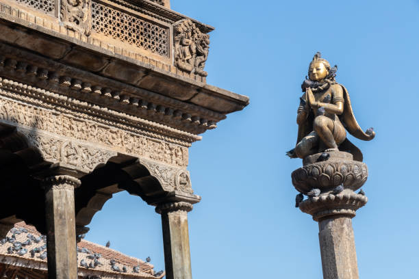 Old Temple in Patan Durbar Square in Nepal Old Temple in Patan Durbar Square in Nepal, is situated at the centre of the city of Lalitpur. It's former ancient royal palace and a marvel of Newar architecture patan durbar square stock pictures, royalty-free photos & images