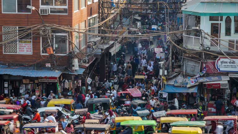 Timelapse View of People and Traffic on the Streets Around Chandni Chawk Market in Old Delhi, India