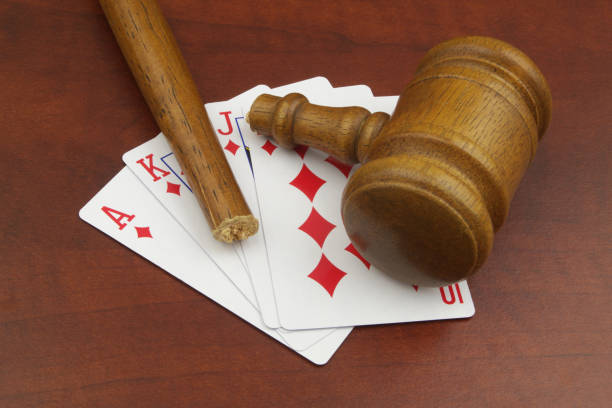 istock Diamonds playing card with broken judge gavel 1474551953