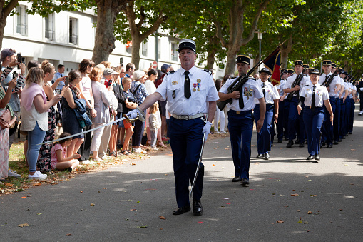 Brest, France - July 14 2022: Gendarmes parading with their machine gun mounted with bayonet during Bastille Day.