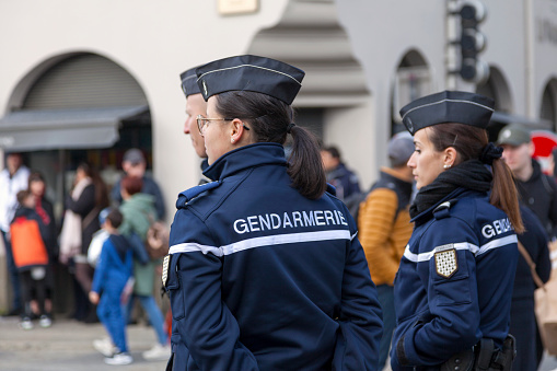 Landerneau, France - April 03 2022: Group of gendarmes surveilling the crowd during the carnival of Landerneau.