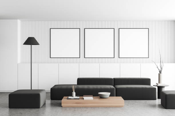 istock Light chill room interior with couch and coffee table, mockup posters 1474562786