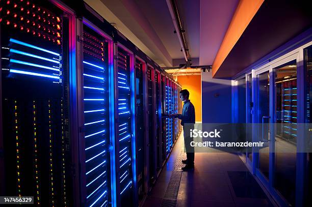 It Engineer In Action Configuring Servers Stock Photo - Download Image Now - Technology, Network Server, Security