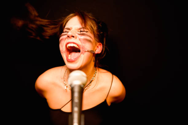 istock The female rock singer. 1474569827