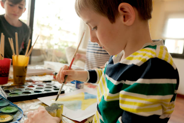 istock Children painting at home, making crafts. 1474570717