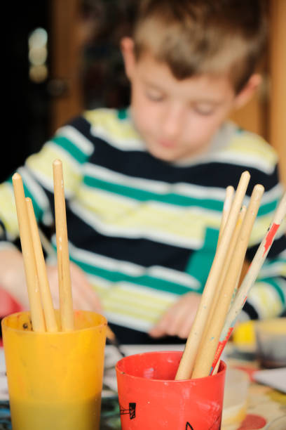 istock Children painting at home, making crafts. 1474571417