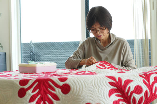 istock Woman making a Hawaiian quilt 1474573763