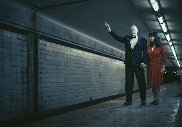 istock elegant couple trying to call a train 147457783