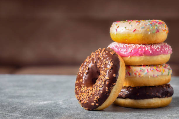 istock Set of multicolored sweet donuts donuts with icing and sprinkles 1474582474