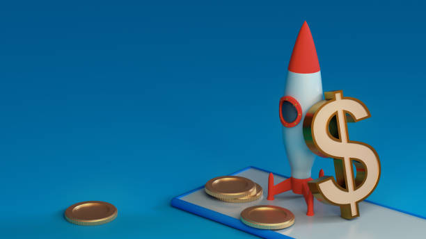 istock dollar symbol is leaning against a rocket set to launch from a smartphone with coins on a blue background with space for text and logo. 3D rendering. Financial concept. Startup 1474586633