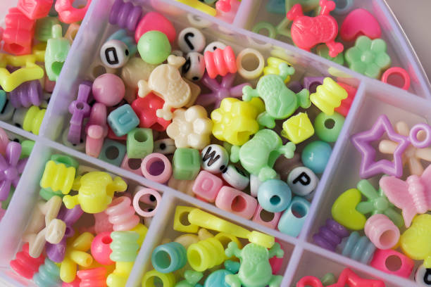 istock A box with various and colorful beads for making children's bracelets. Children's creativity 1474587717