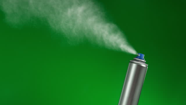 Silver Spray Can Mock-Up Spraying on Green Background