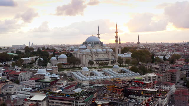 Sunset aerial drone footage video of Süleymaniye Mosque and the Bosporus Harbor istanbul Tulkey
