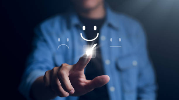 istock Customer service and Satisfaction survey concept. Client choosing on the happy Smile face icon to give satisfaction in service, rating very impressed. review, feedback, best quality, excellent support 1474595788