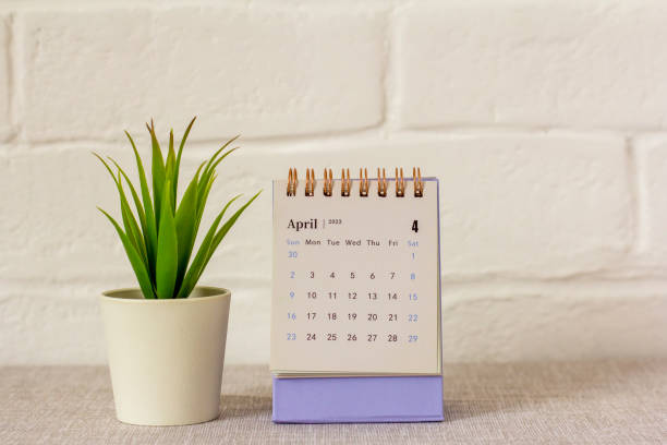 istock Hello April.Desktop calendar for April 2023 on the table. 1474597189