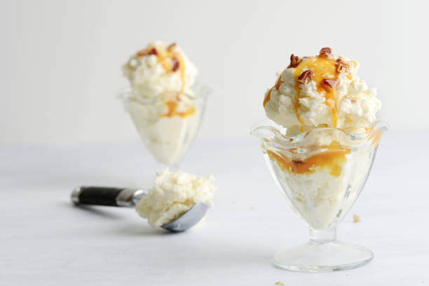 istock scoops of vanilla ice cream with pecans and caramel sauce 1474598418