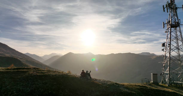 istock Senior couple on hill at sunrise 1474600290