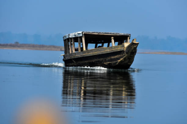 a wooden boat in lake . - moody sky water sport passenger craft scenics imagens e fotografias de stock