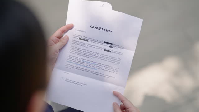 ฺBusinesswoman received a letter of Layoff