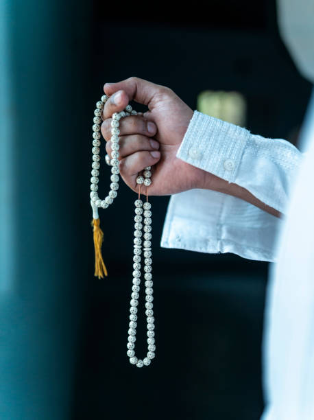 istock Young men with Rosary Beads 1474606083