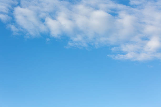 istock High-quality blue sky with a few white clouds - perfect for sky replacements 1474609068