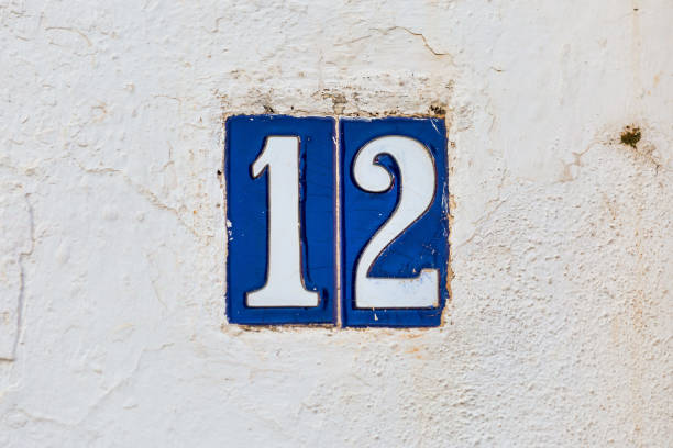 istock Old Weathered House Number 12, Tile on Wall 1474609598