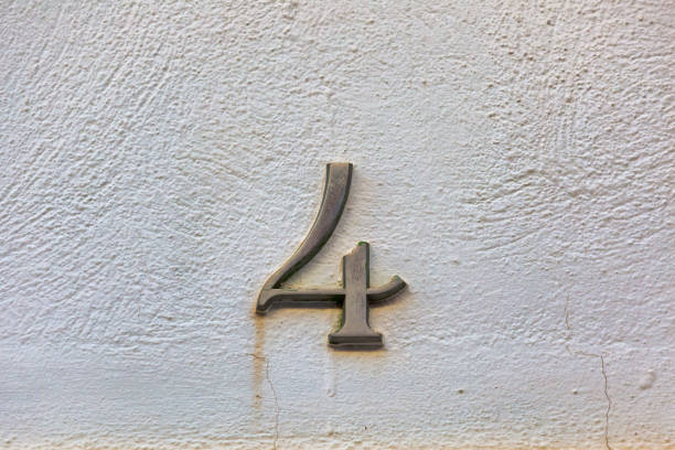 istock Old Weathered House Number 4, Tile on Wall 1474609622