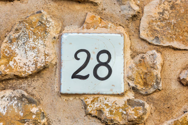istock Old Weathered House Number 28, Tile on Wall 1474610210