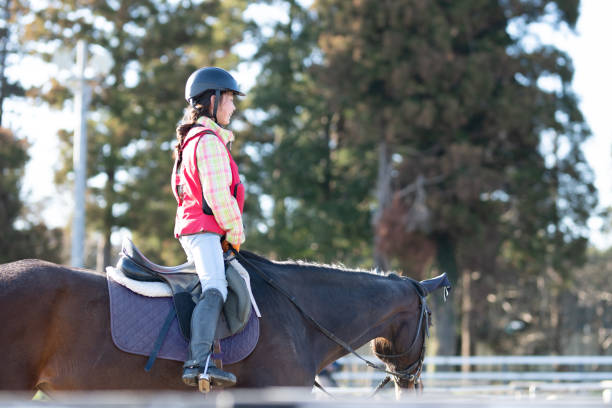 istock Girl practicing horse riding 1474610272
