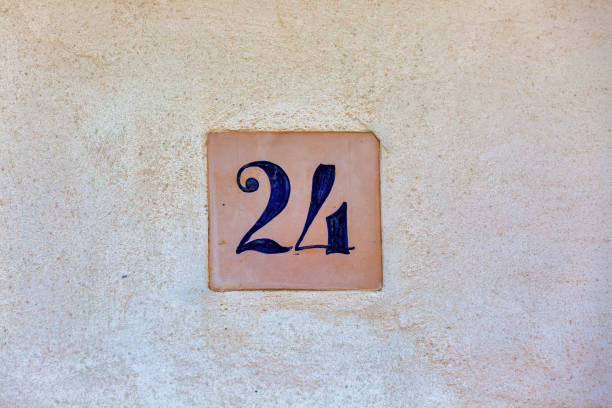 istock Old Weathered House Number 24, Tile on Wall 1474610304