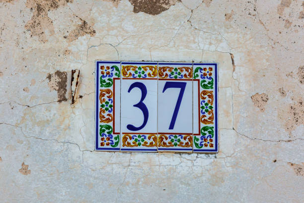 istock Old Weathered House Number 37, Tile on Wall 1474610311