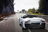 Sports Car on a Coastal Road