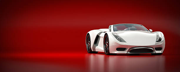 coche deportivo blanco sobre un fondo rojo - coche del futuro fotografías e imágenes de stock