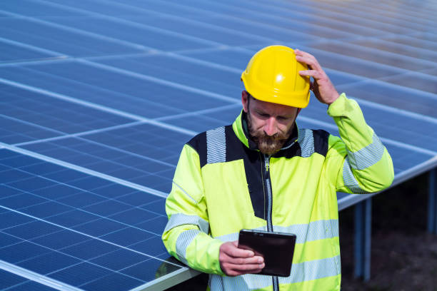 istock Male electrical engineer working with a digital tablet on the solar power plant. 1474613848