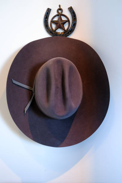 istock Felt cowboy hat hanging on a wall 1474616169