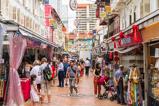 Singapore, Singapore - February 02, 2023: Tourists  walking and enjoying in a Chinatown walking street market in Singapore