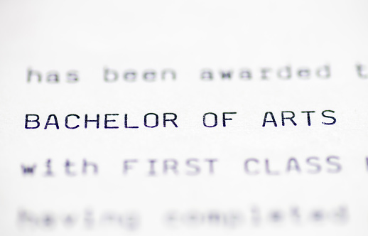 Close up of a higher education certificate with the holder having achieved a Bachelor of Arts degree with first class honours.