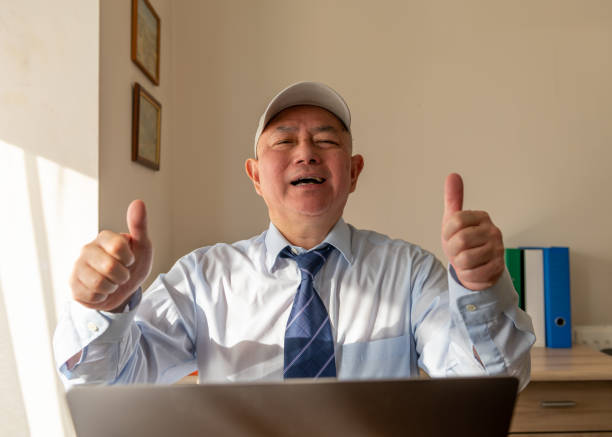 istock A happy businessman in his office. 1474620934