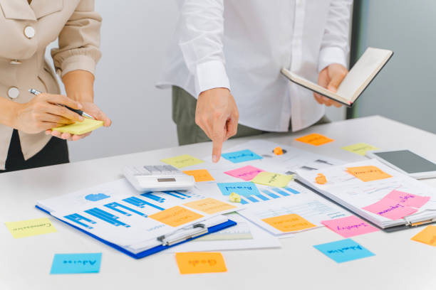 istock Group of startup team coworking with new creative project plan. 1474621988